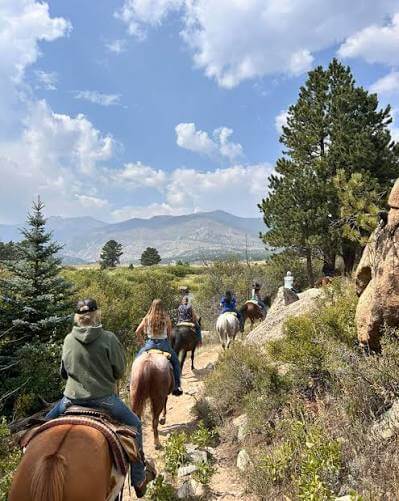Riders on horseback on a mountain trail