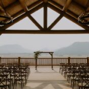 Wedding ceremony setup with chairs and mountain view