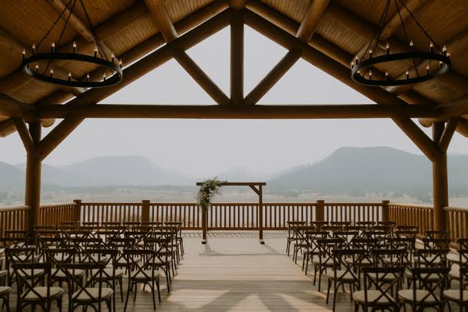 Wedding ceremony setup with chairs and mountain view