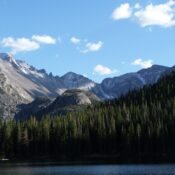 Rocky Mountains with lake and pine forest