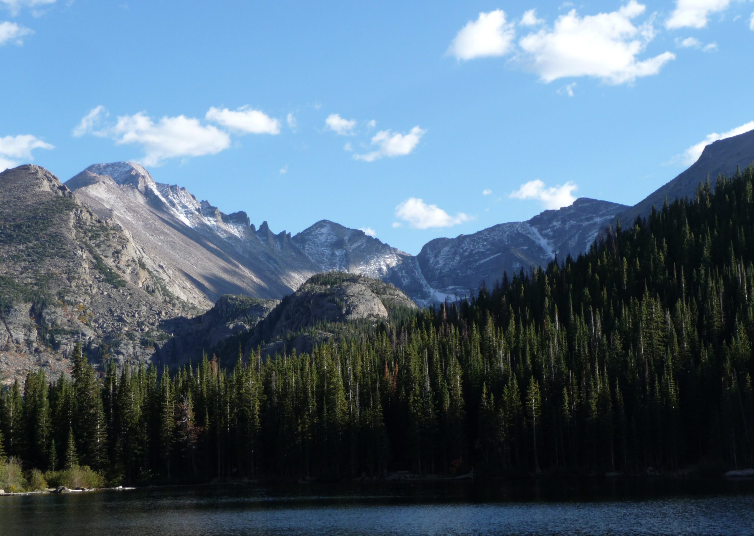 Rocky Mountains with lake and pine forest